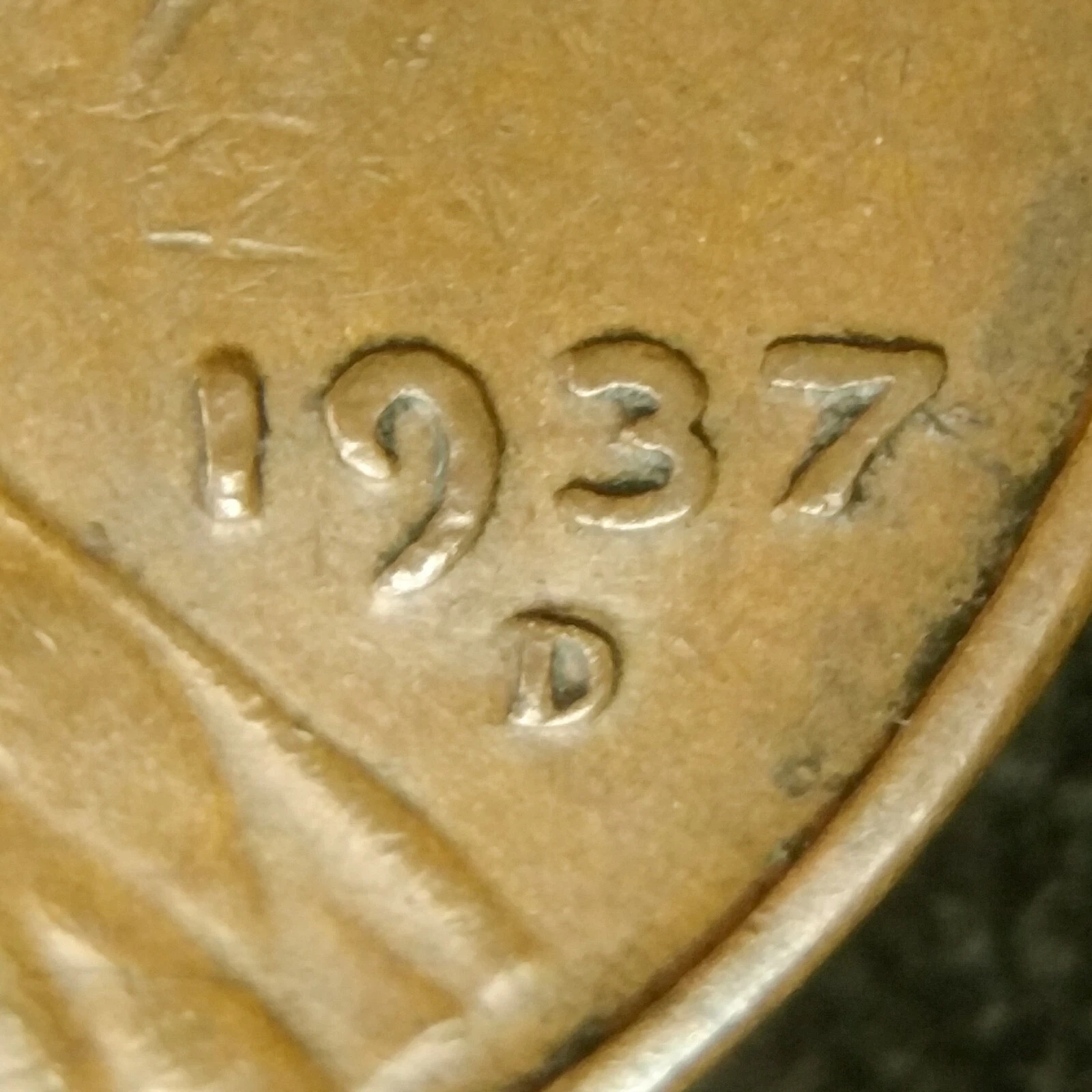 1937-D wheat penny repunched mint mark error showing doubled D mint mark impression under magnification